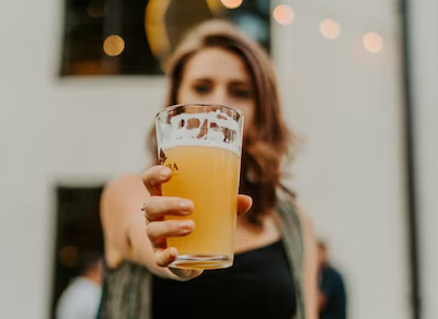 woman with glass of beer